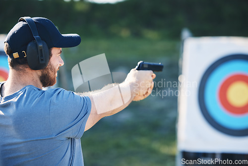 Image of Man, firearm training and target for outdoor challenge, goals and aim for police, army or security academy. Shooting expert, pistol or gun for sport, safety and combat exercise in nature with vision