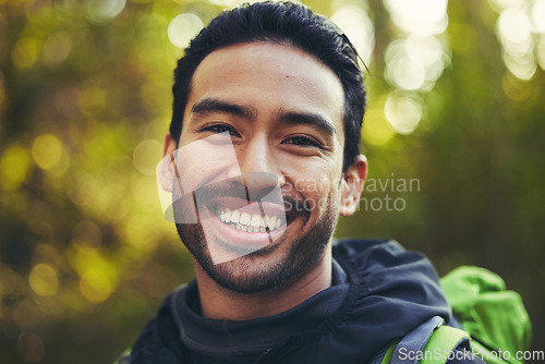 Image of Asian man, portrait or hiking in nature forest, trekking woods or trees environment for adventure, workout or fitness exercise. Smile, happy or training hiker face in travel freedom or fun adventure