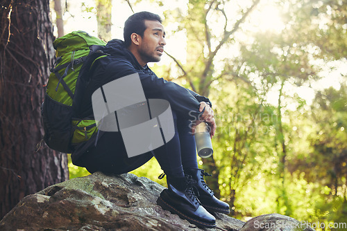 Image of Tired, hiking or water bottle in woods, nature forest or fitness environment for relax, electrolytes or Japanese healthcare. Hiker man, backpacker or sports drink in rest, recovery or fatigue break