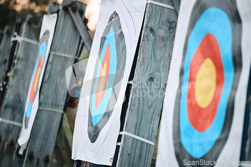 Image of Bullseye target paper, outdoor and field at shooting range for weapon training, aim and accuracy. Sports, archery and poster for gun, bow and arrow at academy for police, army or security for goal