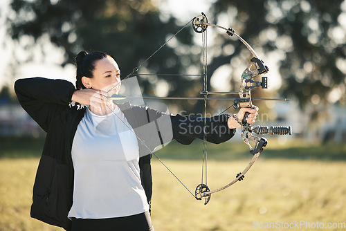 Image of Happy person, bow or arrows aim in sports field, shooting range or gaming nature in hunting, hobby or exercise. Archery, woman or athlete smile with weapon in target training, competition or practice