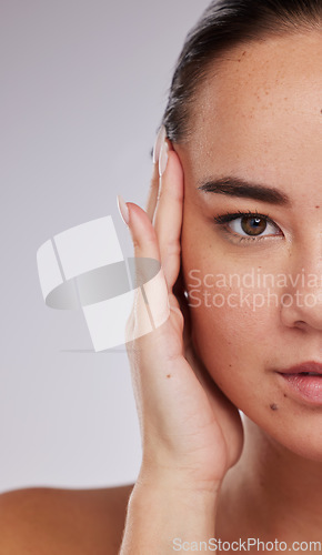 Image of Skincare, portrait and woman in studio for beauty, grooming and cosmetic on grey background. Face, half and closeup of asian girl model relax, eye lift and botox or anti aging skin treatment isolated