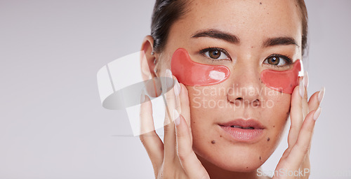 Image of Skincare, face portrait and woman with eye patches in studio isolated on a gray background mock up. Dermatology, cosmetics and female model with facial pads or products for beauty or skin treatment.