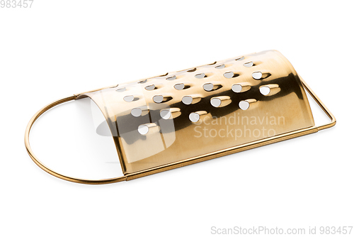 Image of Golden colored metal scraper