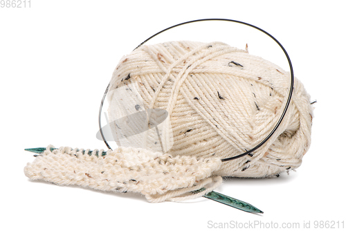 Image of Beige knitting wool with needles