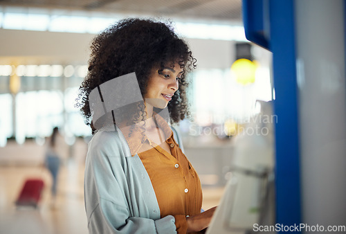 Image of Black woman, airport and self service kiosk for ticket, registration or online boarding pass. African American female traveler by terminal machine for travel application, document or booking flight