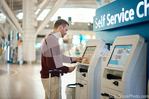 Image of Man, airport and self service kiosk for check in, ticket registration or online boarding pass. Male traveler by terminal machine for travel application, document or booking flight with luggage