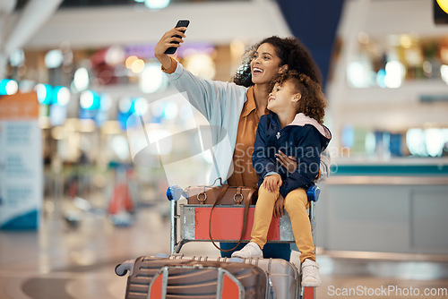 Image of Travel, selfie and smile with mother and daughter in airport for social media, holiday and global journey. Smile, luggage and phone with mom and child picture for vacation, departure and technology