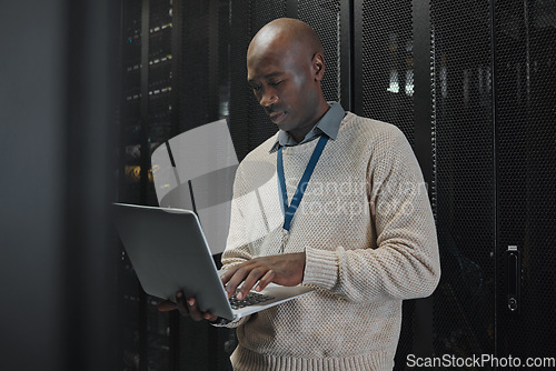 Image of Laptop, server room and black man or technician in data center management, system or cybersecurity. Analysis, serious or power coding solution, engineering programmer or information technology person