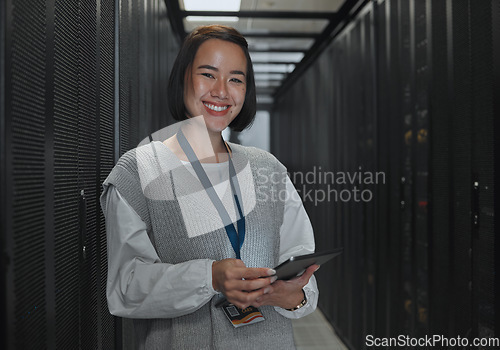 Image of Asian woman, portrait smile and technician with tablet in server room for networking, maintenance or system inspection. Happy female engineer smiling with touchscreen in data management or monitoring