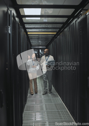 Image of Laptop, teamwork or IT people in server room for maintenance, analysis or digital innovation. Data center, cybersecurity or man and woman programmer for planning network strategy or system firewall