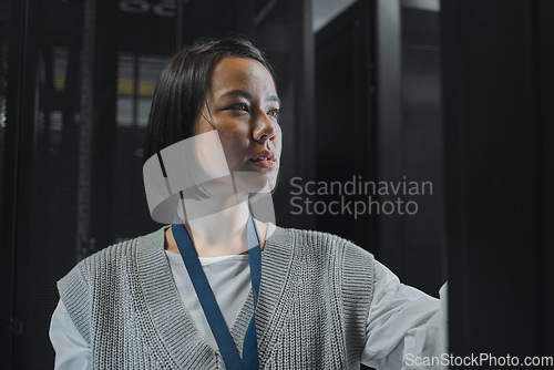 Image of Serious, maintenance or IT woman in server room for analysis, engineer working in data center. Thinking, cybersecurity and girl programmer with tech for problem solving, diagnose or troubleshooting
