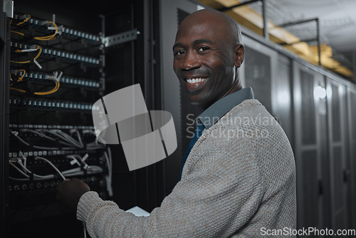 Image of Portrait, server room and black man on tablet for database maintenance or software update at night. Cybersecurity, face or it male engineer coder on tech for programming or networking in data center