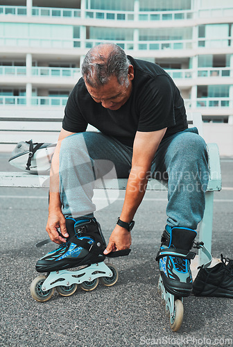 Image of Roller skate, tie shoes and senior man in city for sports, adventure and fitness hobby outdoors. Exercise, weekend and elderly man with shoelaces ready for skating, urban travel activity and journey