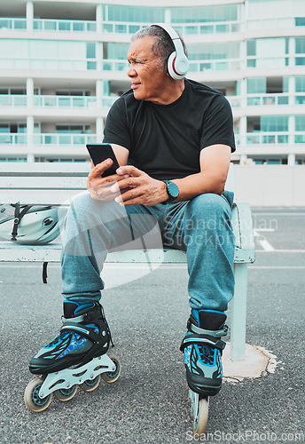 Image of Roller skate, music and senior man with phone in city for sports, exercise and fitness hobby outdoor. Retirement, travel and cool male listen to audio, radio and track for skating, activity and relax
