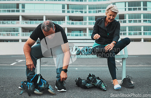 Image of Roller skate, shoes and senior couple in city tie shoelace for sports, adventure and fitness hobby outdoors. Exercise, holiday and elderly man and woman with pain from skating, travel and journey