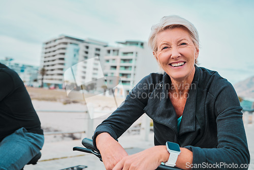 Image of Mature woman, portrait and electrical bike in future transportation, clean energy or sustainability travel. Technology, electric and bicycle for happy, smile or elderly person in eco friendly cycling