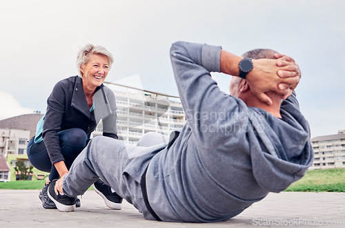 Image of Exercise, health and sit ups with a senior couple training outdoor together for an active lifestyle of training. Workout, fitness or core with a mature man and woman outside on the promenade