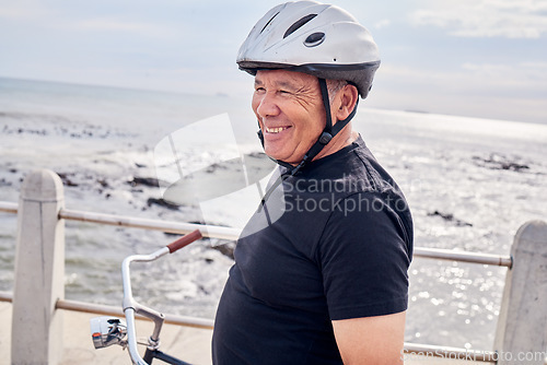 Image of Happy, senior and man by the beach for cycling, training and eco friendly travel in Portugal. Fitness, smile and an elderly person enjoying retirement with a bike ride by the ocean for exercise