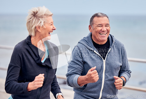 Image of Running, fitness and senior couple smile by ocean for exercise, healthy body and wellness in retirement. Sports, endurance and happy elderly man and woman run, cardio workout and marathon training