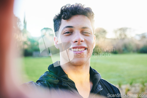 Image of Man, selfie and smile at outdoor park in summer for walk, wellness and portrait by blurred background. Young gen z guy, headshot and nature in spring with profile picture for social media in sunshine