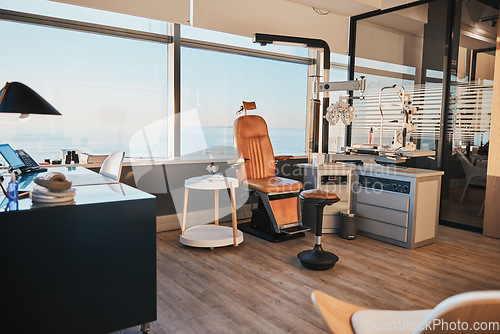 Image of Optometry, equipment and empty office of a doctor for work in ophthalmology, eye and vision care. Healthcare, surgery and room at a clinic for optician workspace, optometrist business and furniture