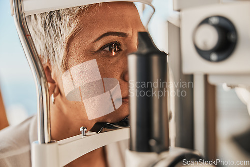 Image of Medical, ophthalmology and eye test by patient senior woman with medical insurance using slit lamp. Mature, optometry and female doing vision or eyesight test in clinic using a machine