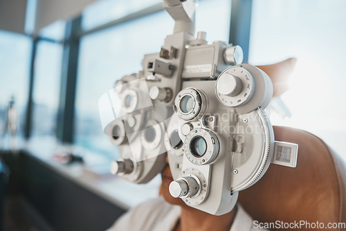 Image of Ophthalmology phoropter, patient consultation or eye exam for vision, healthcare or wellness. Senior woman, ophthalmologist care and health for eyes in office, hospital or store for vision assessment