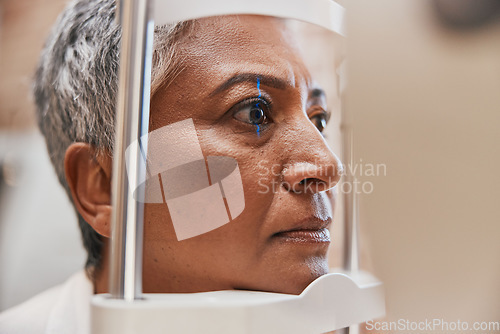 Image of Laser, face or senior woman in eye exam for eyesight at optometrist or ophthalmologist office. Zoom of optician helping a mature customer testing or checking vision, iris or retina visual health