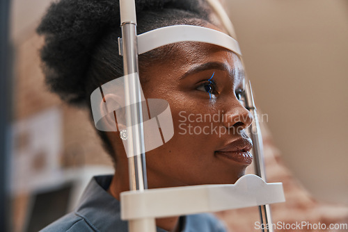 Image of Laser, vision or black woman in eye exam for eyesight at optometrist or ophthalmologist consulting office. Face of optician helping a African customer testing or checking iris or retina visual health
