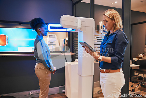 Image of Eye exam, digital machine and optometrist with black woman for eyesight, vision test and optical consulting. Healthcare, ophthalmology and optician with patient and medical tech, monitor and tablet