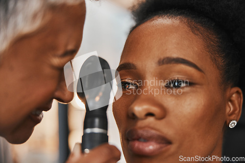 Image of Doctor, face or black woman in eye exam assessment consultation for eyesight at optometrist office. Zoom of optician helping a mature customer testing or checking vision, iris or retina visual health