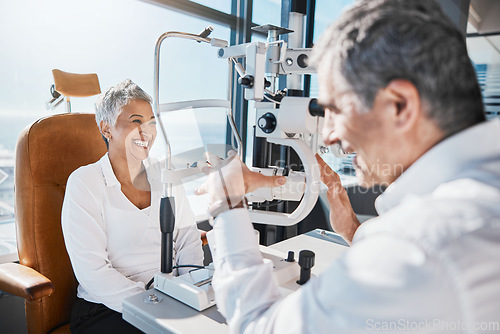 Image of Eye doctor, machine or happy woman consulting for help with eyesight at optometrist in an optical assessment. Optician talking or asking senior customer info testing for vision, iris or retina health