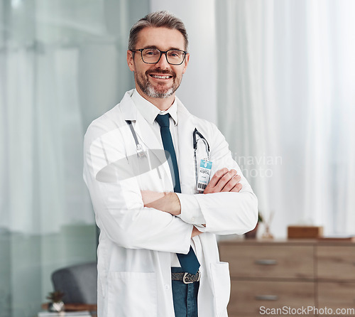 Image of Healthcare, smile and portrait of doctor, man in hospital for support, success and help in medical work. Health, wellness and medicine, confident mature professional with stethoscope and leadership.