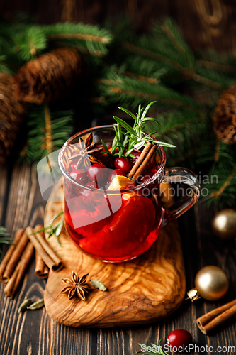 Image of Christmas mulled apple cider with cinnamon, anise and rosemary. Traditional hot drink or beverage, festive Xmas or New Year winter cocktail