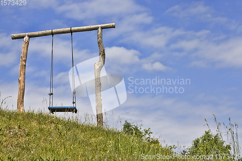 Image of ordinary wooden swing