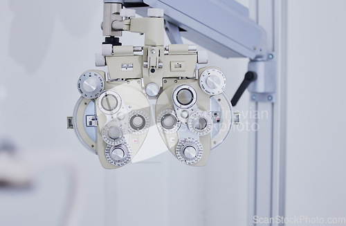 Image of Phoropter, medical optometry and equipment in hospital for eye test or examination. Vision, healthcare and technology or tools for ophthalmology for eyecare, health and eyesight wellness in clinic.
