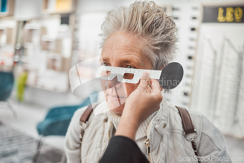 Image of Optometry, measurement and doctor testing eyes of a woman for glasses, frame fitting and eye distance. Healthcare, medical and mature patient with an optometrist to measure vision, lens and eyesight