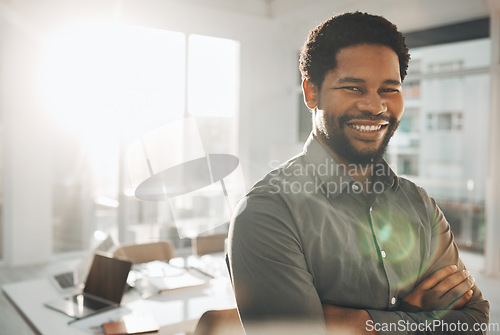 Image of Business, portrait and smile of black man with arms crossed in office for mission or success mindset. Ceo, boss and face of happy, confident or proud male entrepreneur or professional from Nigeria.