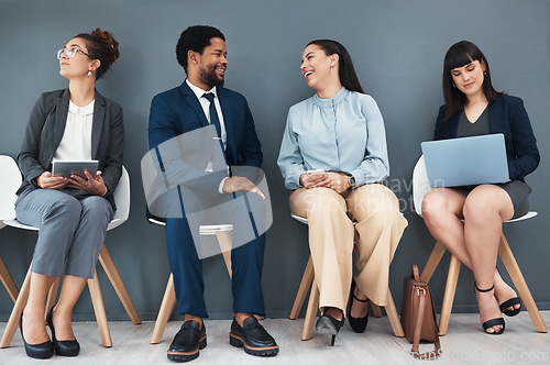 Image of Talking, recruitment and business people in waiting room for interview with human resources. Hr hiring, job and group of candidates, men and women laughing with devices in company for employment.