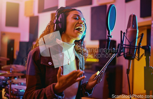 Image of Tablet, music and woman singing in a studio for radio, song production and rehearsal. Creative, voice and a singer making a record, track or recording a musical sound as a professional artist