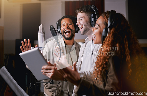 Image of Team, people in recording studio singing and mic, sound equipment with music and artist, diversity and collaboration. Audio, headphones and musician group with tablet, record label and creativity