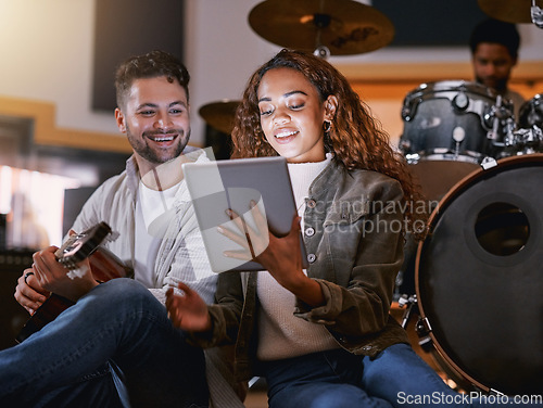 Image of Creative, songwriter and tablet with black couple in recording studio for music, lyrics planning or internet. Production, technology and social media with man and woman for musician, audio or digital