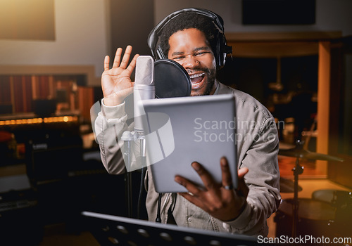 Image of Tablet, music studio and man singing lyrics, song production or musician training for creative industry talent. Radio, microphone and audio of african person or singer voice on digital recording app