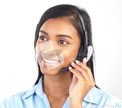Image of Crm, customer service and contact us Indian woman worker on a business call in a studio. Marketing, networking and web support consulting of a employee with a smile from call center sales work