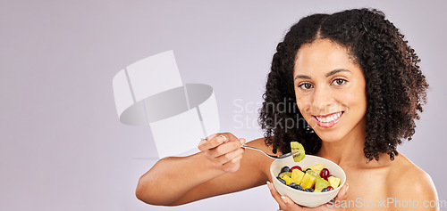 Image of Black woman, fruit salad and studio portrait for breakfast, nutrition and smile by background. Young african, gen z model and fruits for healthy, diet and beauty mockup with energy, happiness or care