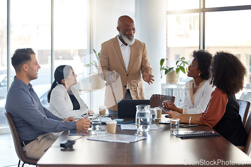 Image of People listening to boss in business meeting, workshop or seminar for office update, strategy or planning. Senior black man, executive or ceo speaking of company management to professional employees