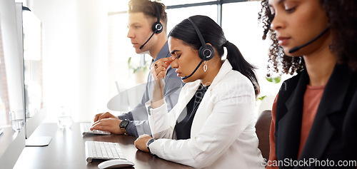 Image of Call center stress, headache and telemarketing team with crm problem in a office with anxiety. Customer service, web support and burnout of a black woman employee working online on a help desk app