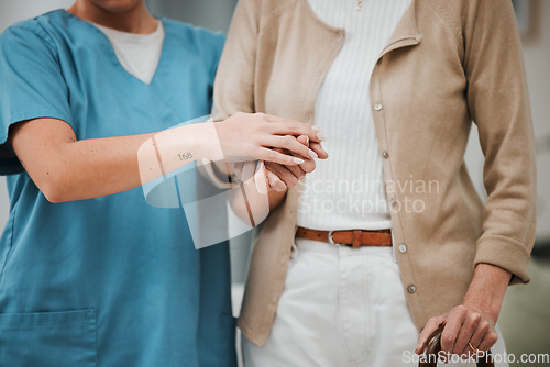 Image of Walking stick, senior woman and nurse holding hands for disability support, help or retirement nursing service. Elderly patient or disabled person with caregiver for Parkinson, arthritis or mobility