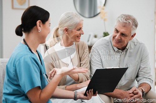 Image of Nurse, healthcare and consulting with a senior couple in their home, talking to a medicine professional. Medical, insurance or life cover with a mature man and woman meeting a medicine professional